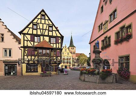 Stock Image - Old town with fountain and church Church of St. Anna, Turckheim, Alsace, France, Europe. Fotosearch