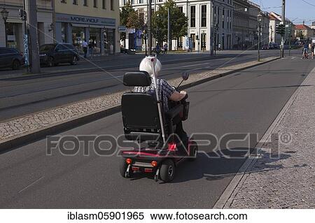 Older lady in a wheelchair on a bicycle path, Potsdam, Brandenburg, Germany, Europe View Large Photo Image Stock Photography - Older lady in a wheelchair on a bicycle path, Potsdam, Brandenburg, Germany, Europe. Fotosearch