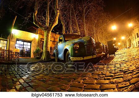 Oldtimer cars on cobblestone street, Avenida Gral Flores at night, Colonia del Sacramento, Uruguay, South America View Large Photo Image Stock Image - Oldtimer cars on cobblestone street, Avenida Gral Flores at night, Colonia del Sacramento, Uruguay, South America. Fotosearch