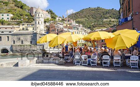 Stock Photograph - Outdoor restaurant by the Harbour in Vernazza, Cinque Terre, Liguria, Italy, Europe. Fotosearch