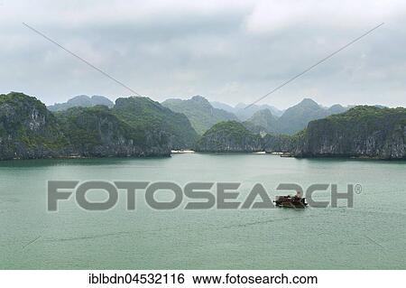 Overgrown limestone karst formations, Lan Ha Bay, Halong Bay, Vietnam, Asia View Large Photo Image Stock Photograph - Overgrown limestone karst formations, Lan Ha Bay, Halong Bay, Vietnam, Asia. Fotosearch