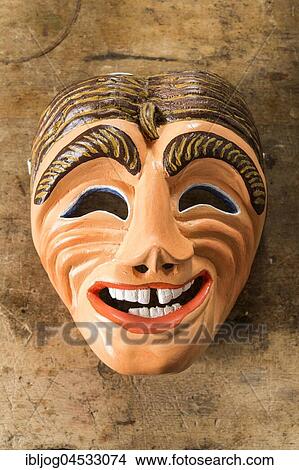 Picture - Painted wooden mask on a workbench, wooden mask carver, Bad Aussee, Styria, Austria, Europe. Fotosearch