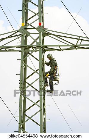 Painter on high-voltage mast, Winnenden, Baden-Wuerttemberg, Germany, Europe View Large Photo Image Stock Photo - Painter on high-voltage mast, Winnenden, Baden-Wuerttemberg, Germany, Europe. Fotosearch
