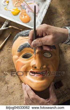 Painting the face of a wooden mask with a paintbrush, on a workbench, wooden mask carver, Bad Aussee, Styria, Austria, Europe View Large Photo Image Stock Image - Painting the face of a wooden mask with a paintbrush, on a workbench, wooden mask carver, Bad Aussee, Styria, Austria, Europe. Fotosearch