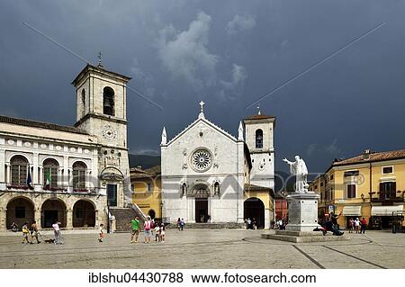 Stock Photo - Palazzo Comunale Town Hall and Basilica di San Benedetto, stormy sky, Norica, Perugia, Umbria, Italy, Europe. Fotosearch