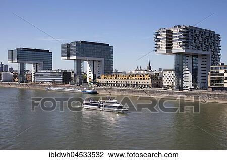 Passenger ship on the Rhine, crane houses, Rheinauhafen, Cologne, North Rhine-Westphalia, Germany, Europe View Large Photo Image Stock Image - Passenger ship on the Rhine, crane houses, Rheinauhafen, Cologne, North Rhine-Westphalia, Germany, Europe. Fotosearch