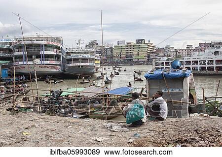 Passengers, harbour, behind it river ferries and small boats, Dhaka, Bangladesh, Asia View Large Photo Image Stock Photo - Passengers, harbour, behind it river ferries and small boats, Dhaka, Bangladesh, Asia. Fotosearch