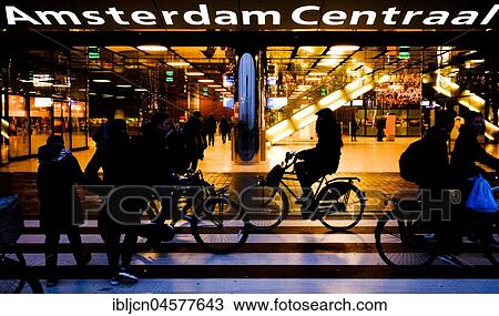 Pedestrian crossing with cyclists in front of the entrance, Amsterdam Central Station, Amsterdam Centraal, Amsterdam, Netherlands View Large Photo Image Stock Image - Pedestrian crossing with cyclists in front of the entrance, Amsterdam Central Station, Amsterdam Centraal, Amsterdam, Netherlands. Fotosearch