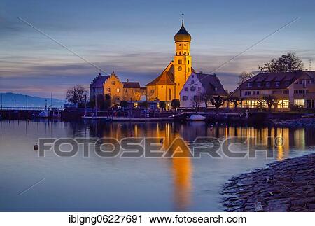 Peninsula with the parish church of St. George at dusk, moated castle on Lake Constance, Swabia, Bavaria, Germany, Europe View Large Photo Image Stock Image - Peninsula with the parish church of St. George at dusk, moated castle on Lake Constance, Swabia, Bavaria, Germany, Europe. Fotosearch