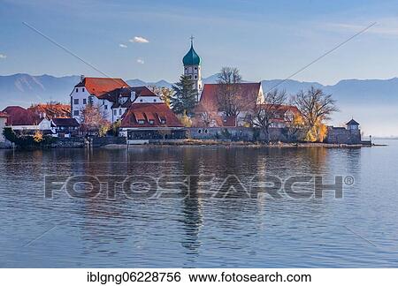 Peninsula with the parish church of St. George in front of the Alps, moated castle on Lake Constance, Swabia, Bavaria, Germany, Europe View Large Photo Image Stock Photograph - Peninsula with the parish church of St. George in front of the Alps, moated castle on Lake Constance, Swabia, Bavaria, Germany, Europe. Fotosearch