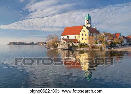 Stock Photography - Peninsula with the parish church of St. George, moated castle on Lake Constance, Swabia, Bavaria, Germany, Europe. Fotosearch