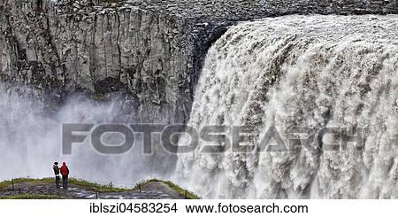 People at the waterfall Dettifoss, river Jökulsá á Fjöllum, Northern Iceland, Island View Large Photo Image Picture - People at the waterfall Dettifoss, river Jökulsá á Fjöllum, Northern Iceland, Island. Fotosearch