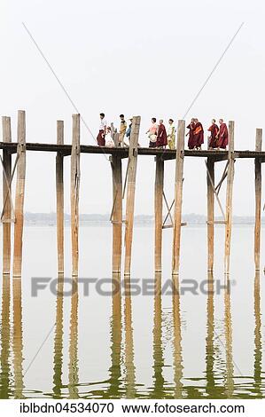 People crossing U Bein bridge, Taungthaman Lake, Mandalay region, Myanmar, Asia View Large Photo Image Stock Image - People crossing U Bein bridge, Taungthaman Lake, Mandalay region, Myanmar, Asia. Fotosearch