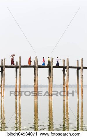 People crossing U Bein bridge, Taungthaman Lake, Mandalay region, Myanmar, Asia View Large Photo Image Stock Image - People crossing U Bein bridge, Taungthaman Lake, Mandalay region, Myanmar, Asia. Fotosearch