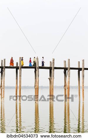 People crossing U Bein bridge, Taungthaman Lake, Mandalay region, Myanmar, Asia View Large Photo Image Stock Image - People crossing U Bein bridge, Taungthaman Lake, Mandalay region, Myanmar, Asia. Fotosearch