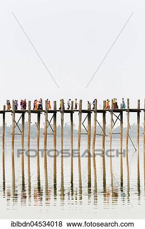 People crossing U Bein bridge, Taungthaman Lake, Mandalay region, Myanmar, Asia View Large Photo Image Stock Photo - People crossing U Bein bridge, Taungthaman Lake, Mandalay region, Myanmar, Asia. Fotosearch