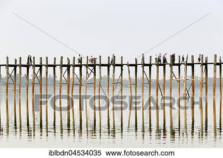 People crossing U Bein bridge, Taungthaman Lake, Mandalay region, Myanmar, Asia View Large Photo Image Stock Photography - People crossing U Bein bridge, Taungthaman Lake, Mandalay region, Myanmar, Asia. Fotosearch