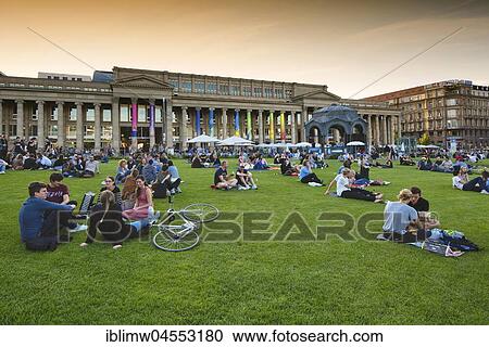 People sit in a meadow, Schlossplatz in front of Königsbau, Stuttgart, Baden-Württemberg, Germany, Europe View Large Photo Image Stock Image - People sit in a meadow, Schlossplatz in front of Königsbau, Stuttgart, Baden-Württemberg, Germany, Europe. Fotosearch