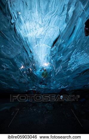 Person in an ice cave with headlamp, Vatnajökull glacier, Iceland, Europe View Large Photo Image Stock Photograph - Person in an ice cave with headlamp, Vatnajökull glacier, Iceland, Europe. Fotosearch