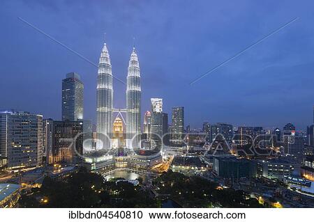 Stock Image - Petronas twin towers at dusk, Kuala Lumpur, Malaysia, Asia. Fotosearch