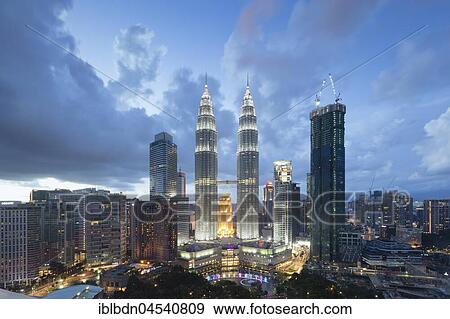 Stock Photo - Petronas twin towers at dusk, Kuala Lumpur, Malaysia, Asia. Fotosearch