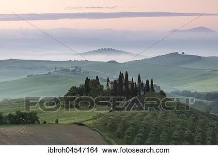 Picture - Podere Belvedere, single homestead, morning atmosphere with fog, San Quirico d'Orcia, Val d'Orcia, Tuscany, Italy, Europe. Fotosearch