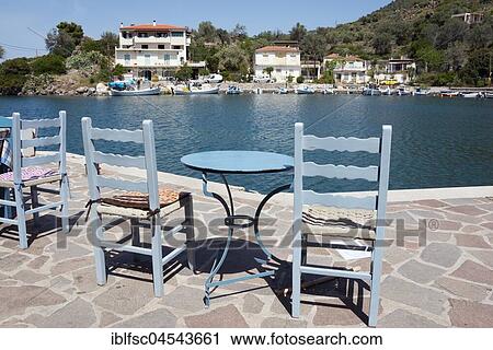 Port, chairs and table, Vathi, Methana peninsula, Argolis, Saronic Islands, Peloponnese, Greece, Europe View Large Photo Image Stock Image - Port, chairs and table, Vathi, Methana peninsula, Argolis, Saronic Islands, Peloponnese, Greece, Europe. Fotosearch