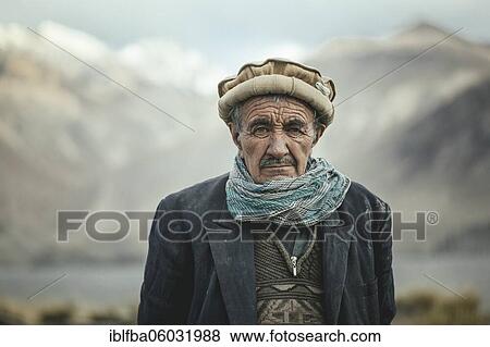 Portrait of a village chief, settled Wakhi, behind him the mountains of the Hindu Kush, Wakhan Corridor, Saradh-e-Broghil, Afghanistan, Asia View Large Photo Image Stock Photo - Portrait of a village chief, settled Wakhi, behind him the mountains of the Hindu Kush, Wakhan Corridor, Saradh-e-Broghil, Afghanistan, Asia. Fotosearch