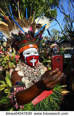 Stock Photo - Preparations of the highland tribes, War Kang group, for the big Sing-Sing of Goroka, Goroka, Papua New Guinea, Oceania. Fotosearch