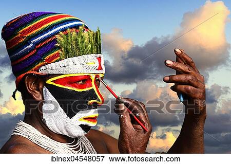Stock Photo - Preparing of the highland tribes, Hooks Ambe group, for the great yearly sing-sing of Goroka, Goroka, Papua New Guinea, Oceania. Fotosearch