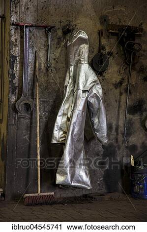 Protective suit of a steel worker hanging on the wall at furnace 8, ThyssenKrupp ironworks, Duisburg, Ruhr area, North Rhine-Westphalia, Germany, Europe View Large Photo Image Stock Image - Protective suit of a steel worker hanging on the wall at furnace 8, ThyssenKrupp ironworks, Duisburg, Ruhr area, North Rhine-Westphalia, Germany, Europe. Fotosearch