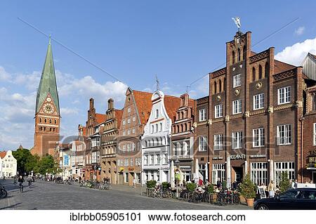 Protestant church St. Johannis and town houses Am Sande, North German brick houses with stepped gables, Lüneburg, Lower Saxony, Germany, Europe View Large Photo Image Stock Image - Protestant church St. Johannis and town houses Am Sande, North German brick houses with stepped gables, Lüneburg, Lower Saxony, Germany, Europe. Fotosearch