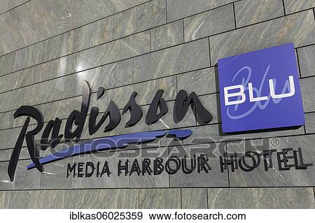 Stock Photo - Radisson Blu Media Harbour Hotel, logo on building, Media Harbour Düsseldorf, North Rhine-Westphalia, Germany, Europe. Fotosearch