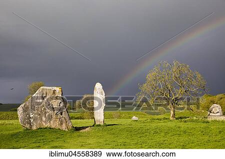 Stock Photo - Rainbow over a ring of standing stones, stone circle, Avebury, Wiltshire, England, United Kingdom, Europe. Fotosearch