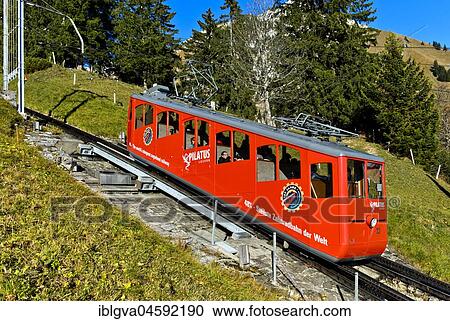 Red car of the Pilatusbahn on the ascent to Mount Pilatus, Alpnachstad, Switzerland, Europe View Large Photo Image Stock Image - Red car of the Pilatusbahn on the ascent to Mount Pilatus, Alpnachstad, Switzerland, Europe. Fotosearch
