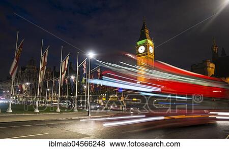 Stock Photo - Red double-decker bus in front of Big Ben, Houses of Parliament, light tracks, night scene, City of Westminster, London, London region, England, Great Britain. Fotosearch