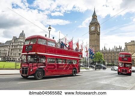 Stock Image - Red double-decker buses, Big Ben with Westminster Palace, London, England, Great Britain. Fotosearch