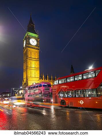 Stock Image - Red double-decker buses in front of Big Ben, Houses of Parliament, light tracks, night scene, City of Westminster, London, London region, England, Great Britain. Fotosearch