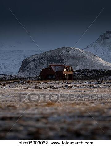 Red house in front of a snow-covered mountain with dramatic lighting effects, Olafsvik, Iceland, Europe View Large Photo Image Stock Image - Red house in front of a snow-covered mountain with dramatic lighting effects, Olafsvik, Iceland, Europe. Fotosearch