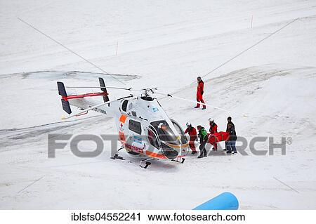 Rescue of an injured person with the helicopter, Dachstein glacier, mountain station on the Dachstein, Schladminger Tauern, Styria, Austria, Europe View Large Photo Image Stock Image - Rescue of an injured person with the helicopter, Dachstein glacier, mountain station on the Dachstein, Schladminger Tauern, Styria, Austria, Europe. Fotosearch