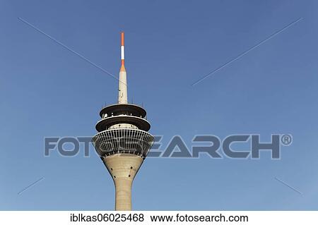 Rhine tower in front of a blue sky, television tower, media harbour Düsseldorf, North Rhine-Westphalia, Germany, Europe View Large Photo Image Stock Photo - Rhine tower in front of a blue sky, television tower, media harbour Düsseldorf, North Rhine-Westphalia, Germany, Europe. Fotosearch