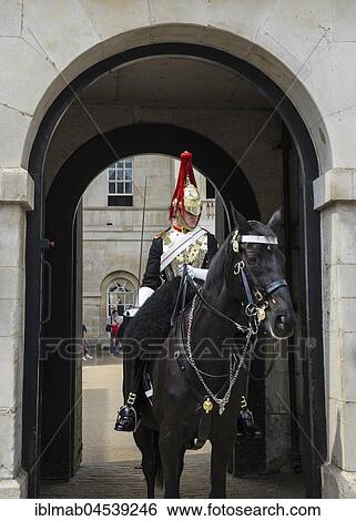 Stock Photograph - Rider of the Horse Guards, barracks of the Household Cavalry elite troops, Whitehall Street, London, England, United Kingdom, Europe. Fotosearch