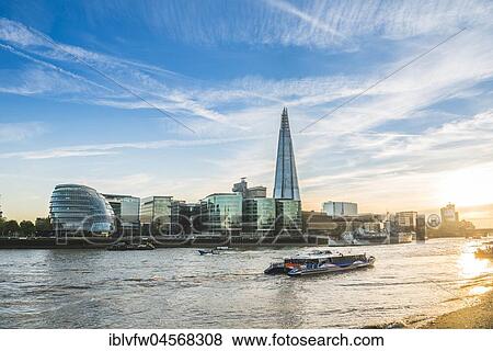 Riverside promenade on the Thames, Tower Pier, Skyline of the office complex More London Riverside, London City Hall, City Hall, The Shard, Thames at sunset, Southwark, London, England, United Kingdom, Europe View Large Photo Image Stock Photo - Riverside promenade on the Thames, Tower Pier, Skyline of the office complex More London Riverside, London City Hall, City Hall, The Shard, Thames at sunset, Southwark, London, England, United Kingdom, Europe. Fotosearch