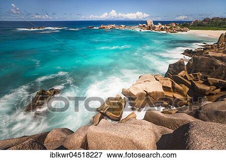 Stock Photo - Rocky beach with turquoise water, La Digue, Indian Ocean, Seychelles, Africa. Fotosearch