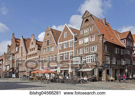 Stock Image - Row of brick houses, Am Sande, Lüneburg, Lower Saxony, Germany, Europe. Fotosearch