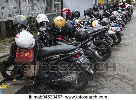 Row of many parked scooters, Yogyakarta, Java, Indonesia, Asia View Large Photo Image Stock Photo - Row of many parked scooters, Yogyakarta, Java, Indonesia, Asia. Fotosearch