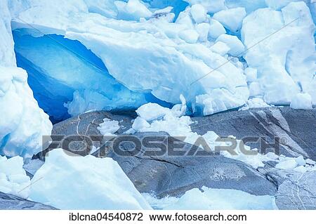 Stock Image - Rugged glacier ice with rock, Nigardsbreen, Sogn og Fjordane, Norway, Europe. Fotosearch