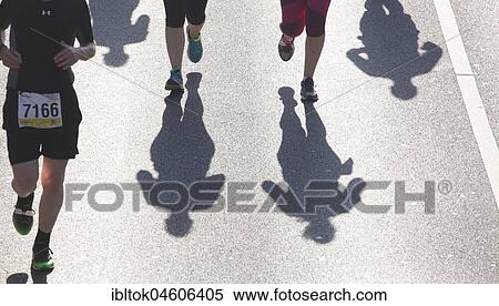 Runner with shadow, Bremen-Marathon, Bremen, Germany, Europe View Large Photo Image Stock Photography - Runner with shadow, Bremen-Marathon, Bremen, Germany, Europe. Fotosearch