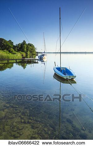 Sailing boats moored in the Schaalsee, Schaalsee Biosphere Reserve, Mecklenburg-Western Pomerania, Germany, Europe View Large Photo Image Stock Image - Sailing boats moored in the Schaalsee, Schaalsee Biosphere Reserve, Mecklenburg-Western Pomerania, Germany, Europe. Fotosearch
