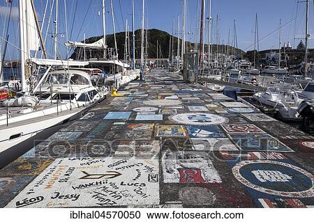 Sailor painted quay wall, harbour, marina, Horta, island of Faial, Azores, Portugal, Europe View Large Photo Image Stock Image - Sailor painted quay wall, harbour, marina, Horta, island of Faial, Azores, Portugal, Europe. Fotosearch